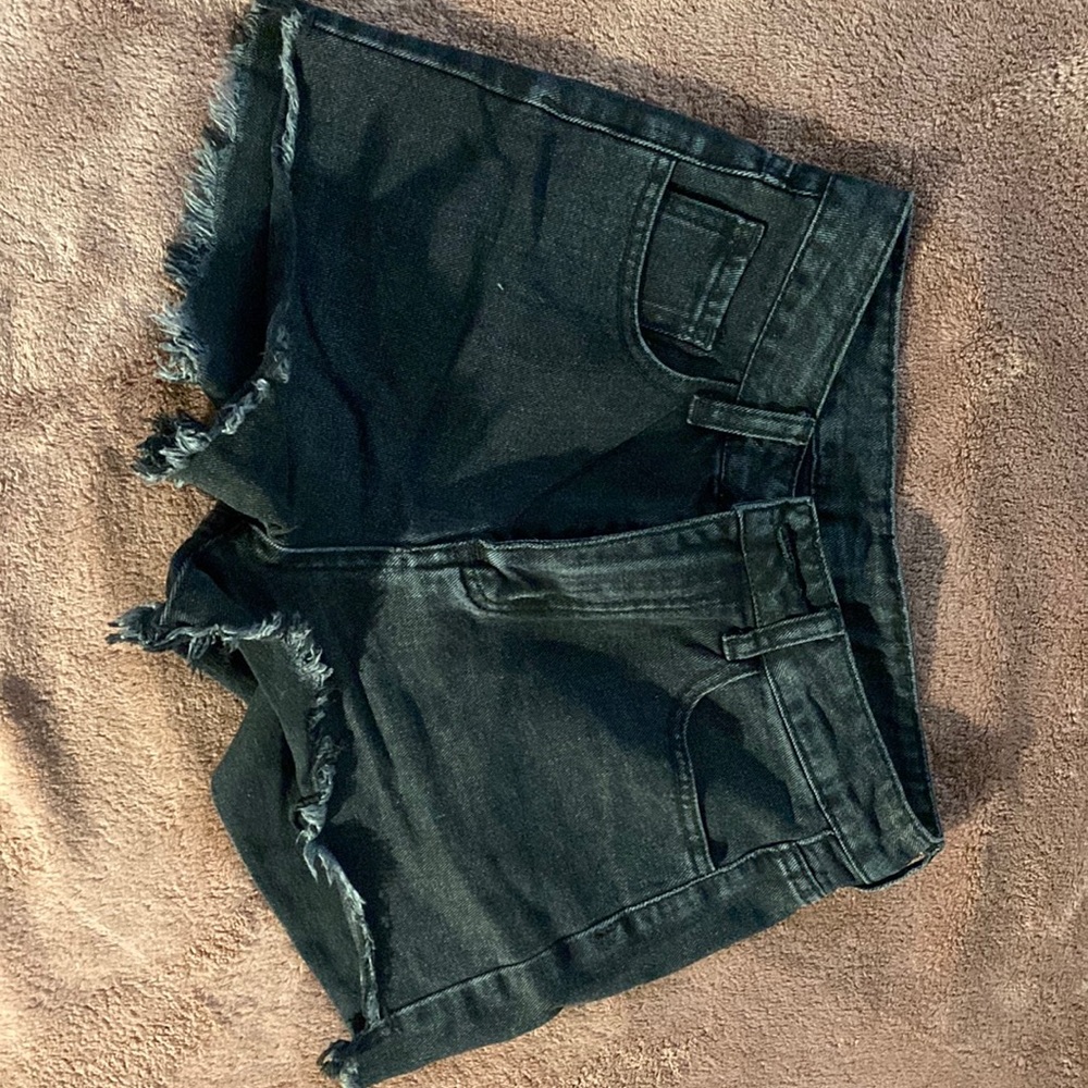 Black cut off shorts.